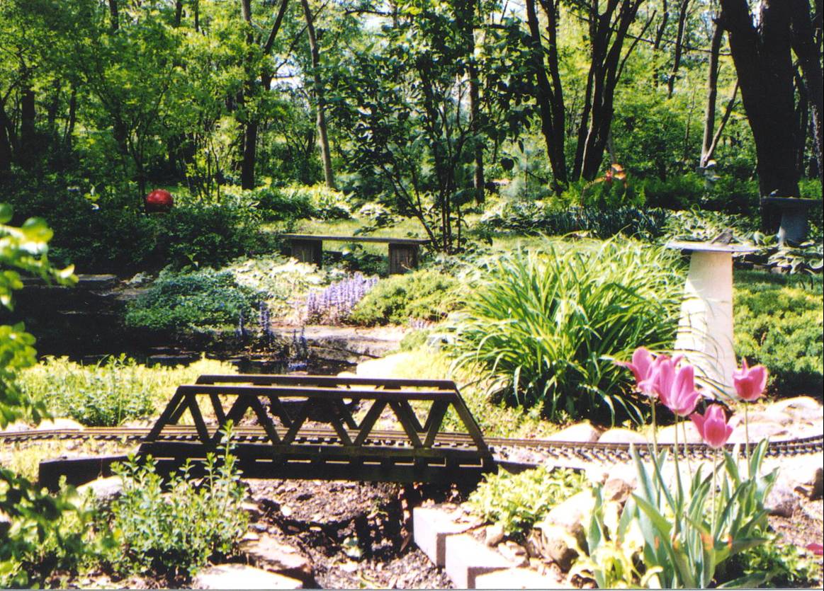 Pond and stream encircled by a railroad